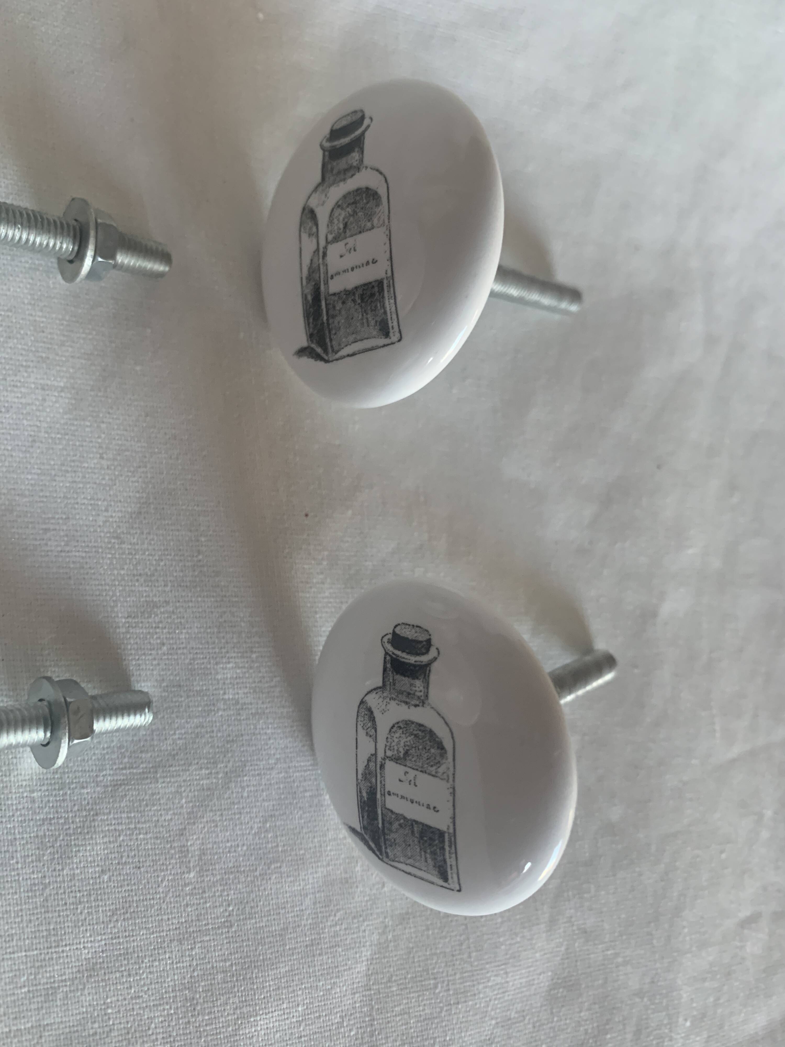 white ceramic door knobs with illustration