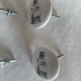 white ceramic door knobs with illustration