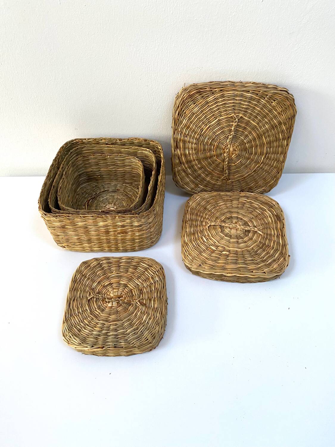 Vintage trio of small rattan nesting baskets