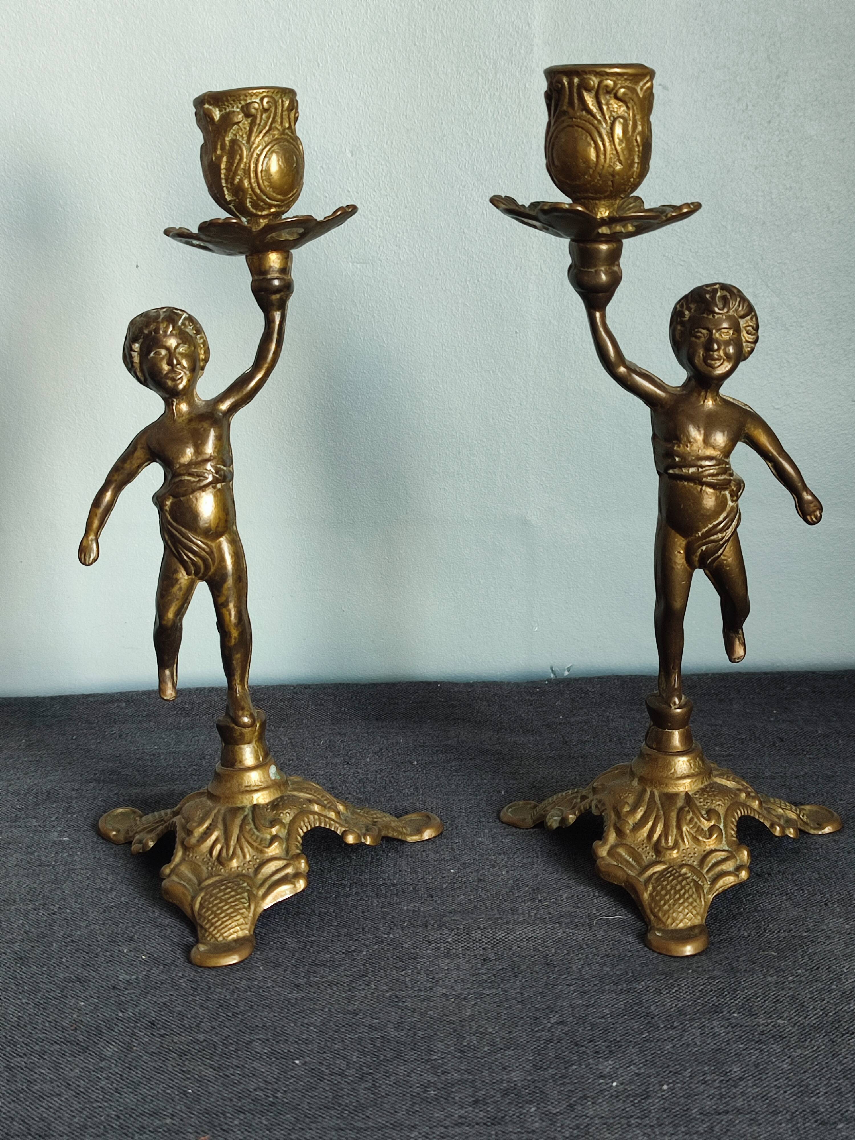 Set of two cherub cherub candlesticks