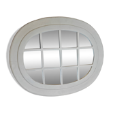 Oval mirror in window style with wooden crossbars – chic country decor