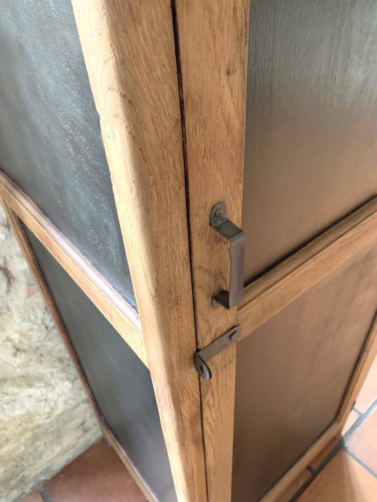 Vintage wooden wardrobe with matte cast iron color hanging rail