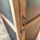 Vintage wooden wardrobe with matte cast iron color hanging rail