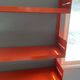 Modular red metal wall shelf in Congresso Lips Vago style.