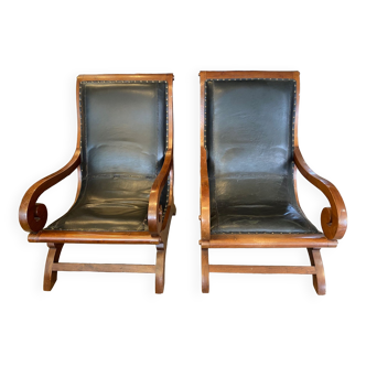 Pair of colonial planter armchairs in teak and black leather from the 80s Roche Bobois