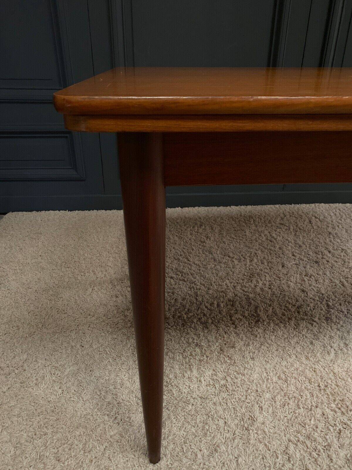 Scandinavian rectangular teak dining table with 4 tapered legs