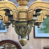 Golden wooden chandelier with crystal pendants from the 19th century.