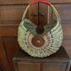 Large antique half-moon rattan basket