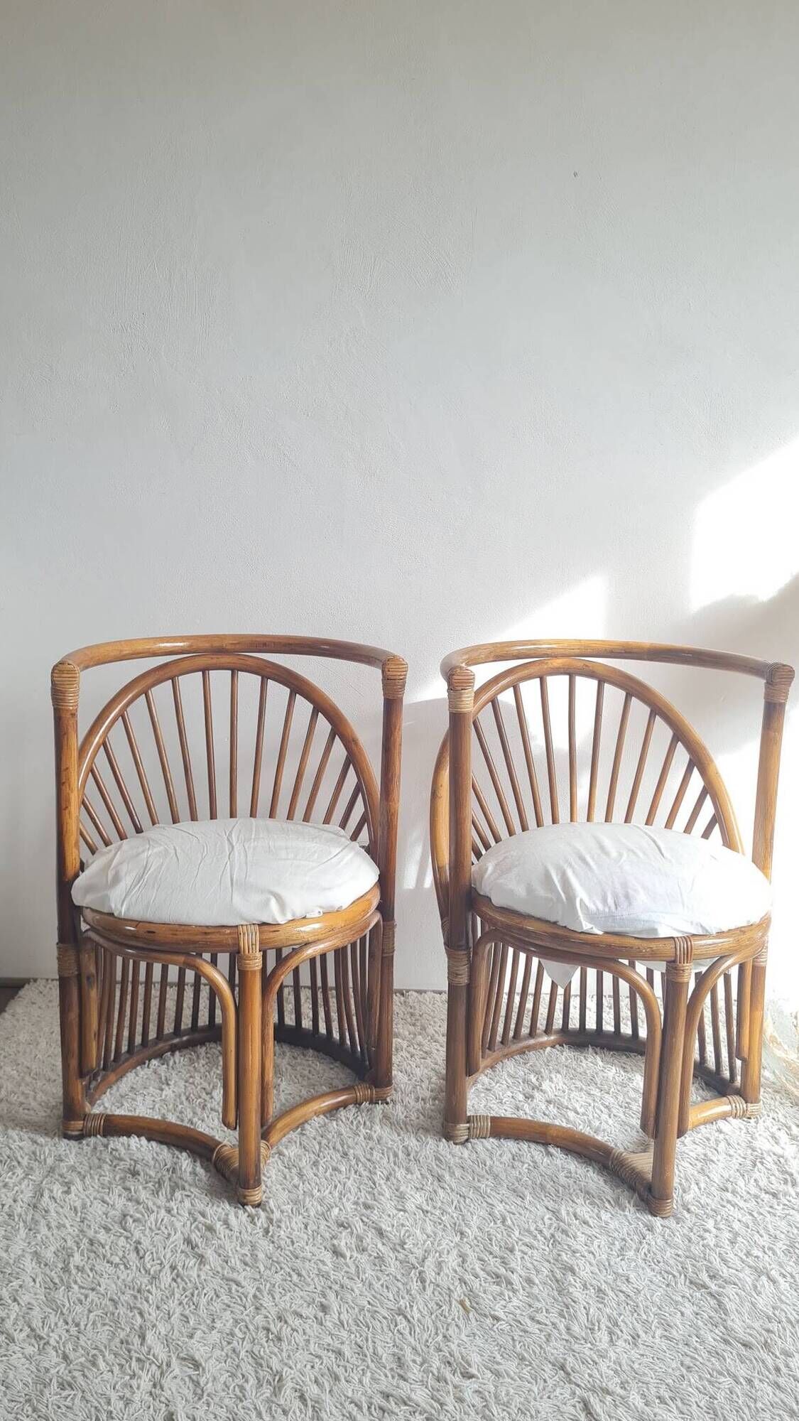 Pair of vintage rattan armchairs circa the 1960s.