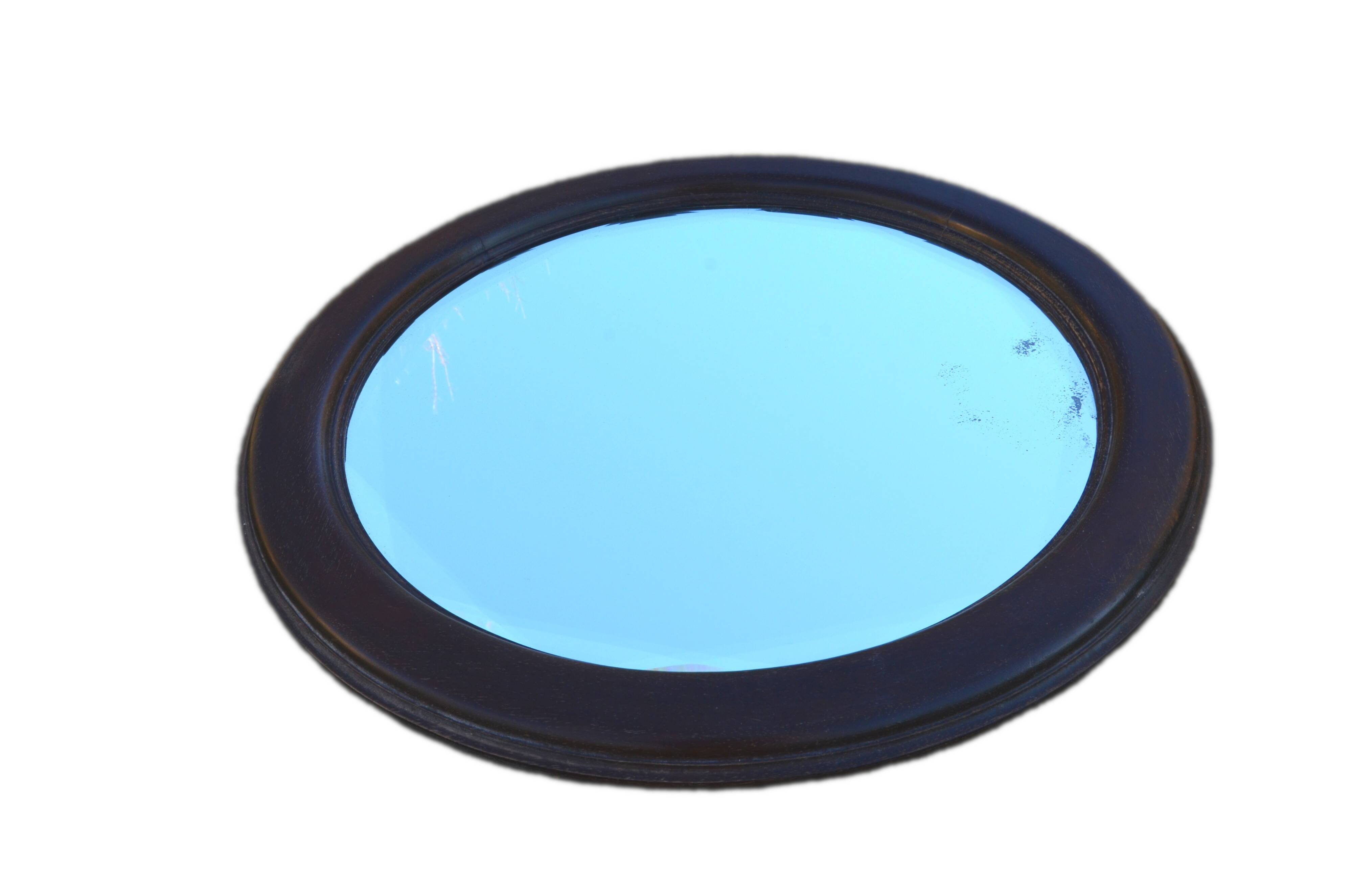 Round mirror in solid oak, bevelled, damaged, diameter 56cm.