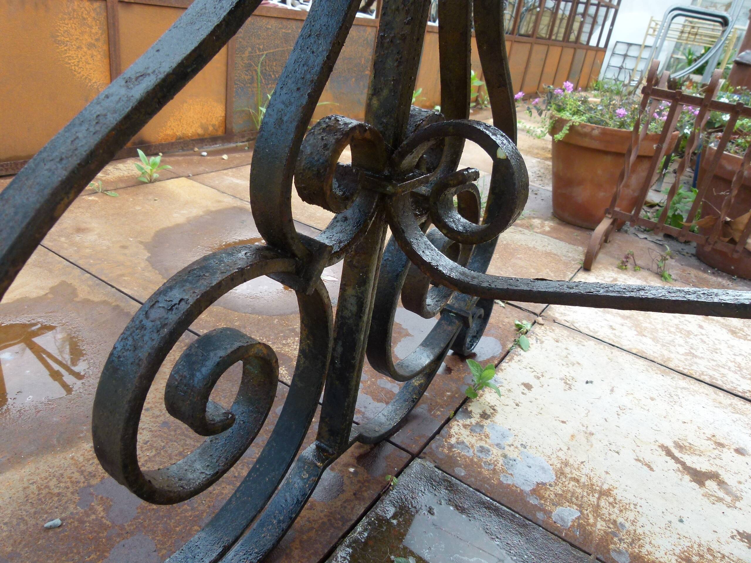 Marble table with wrought iron legs.