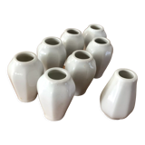 8 miniature vases in white earthenware