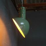 Old industrial enamel lamp in green