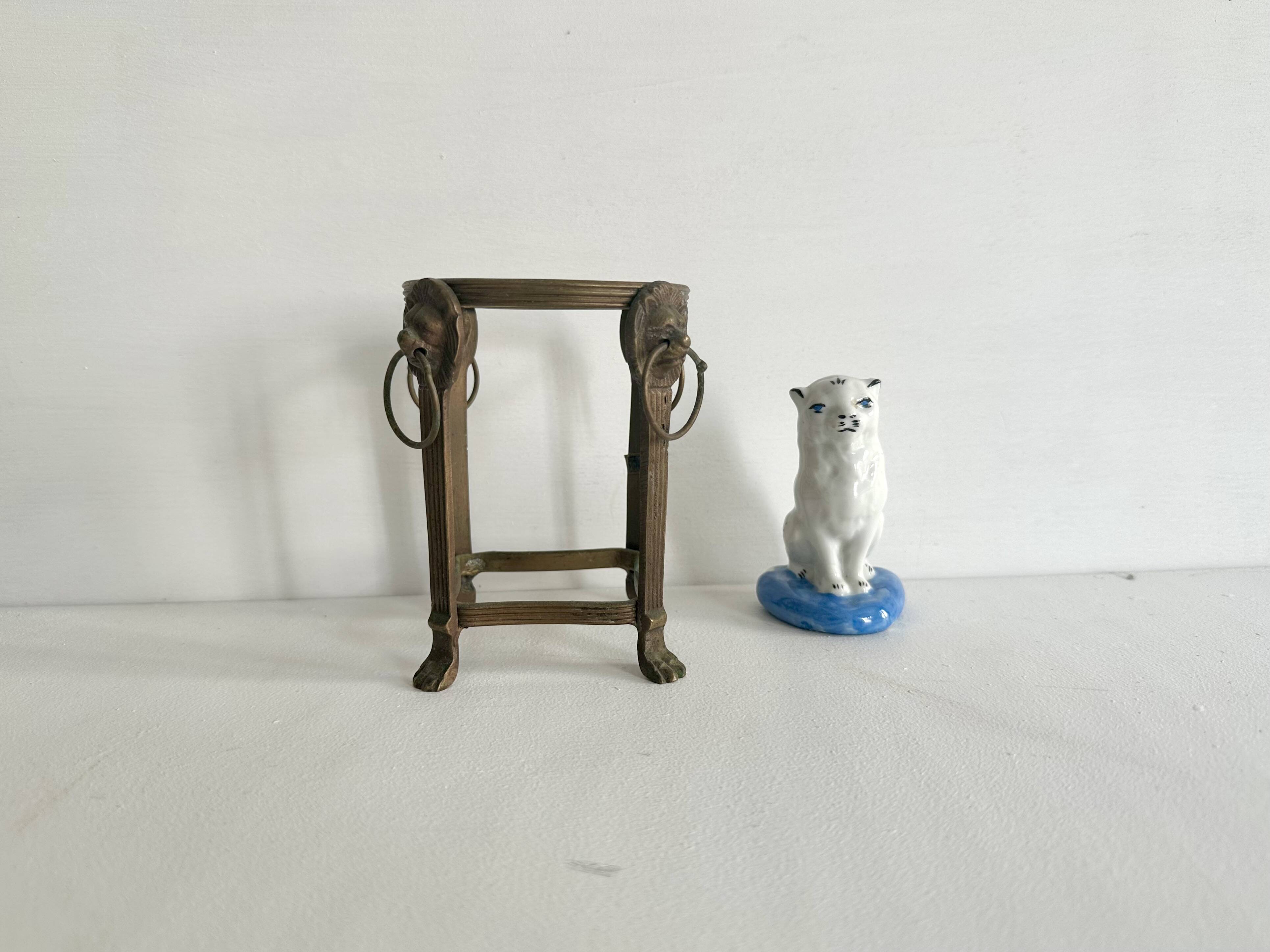 Small ancient glazed ceramic cat from the 19th century.