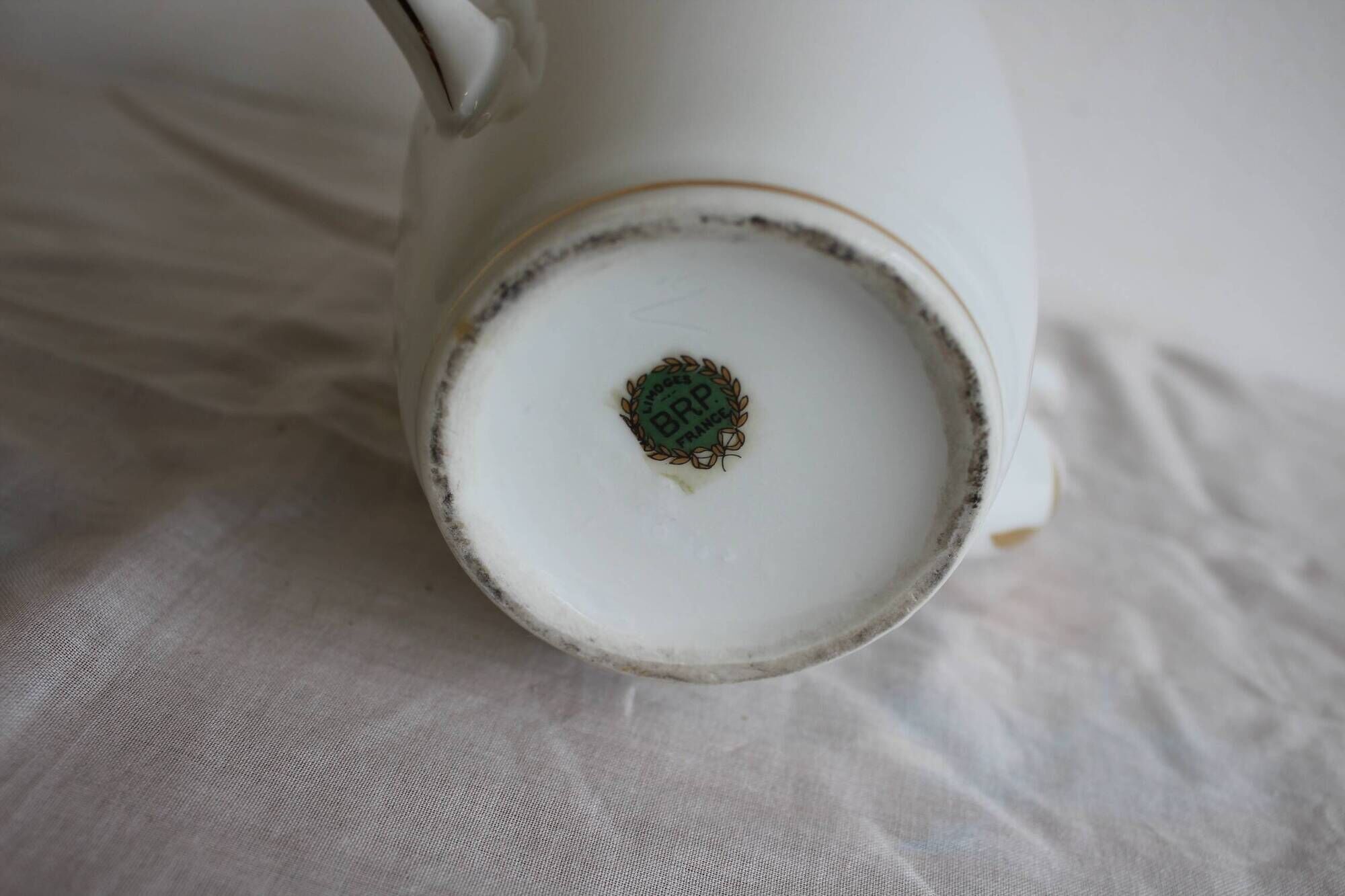 Antique coffee pot in white Limoges porcelain with floral motifs