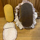1960s wicker cradle with mattress and drapes.