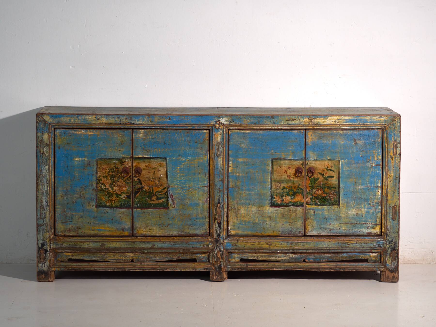Old wooden entrance buffet in blue and yellow tones (circa 1920).