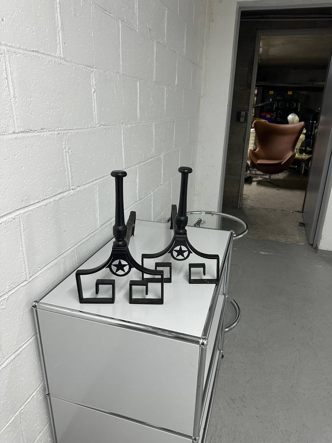 Pair of designer cast iron andirons