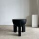 Black mango wood tripod side table with a semi-spherical top, height: 45 cm, diameter: 44 cm.
