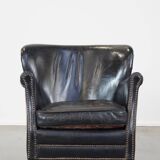 Subtle black armchair with reversible Kelim seat cushion