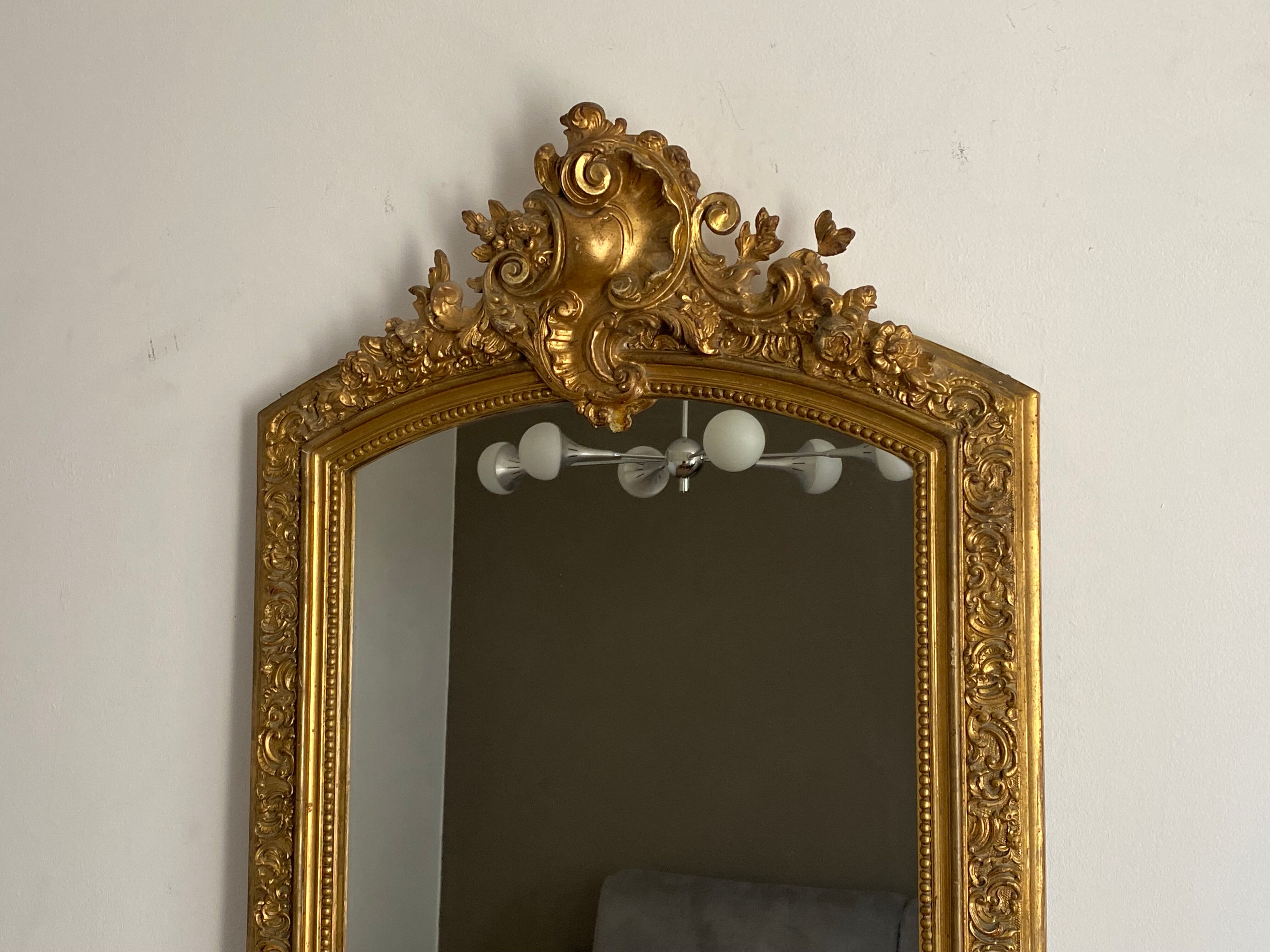 Late 19th century gilded mirror with decorated pediment 125x70cm