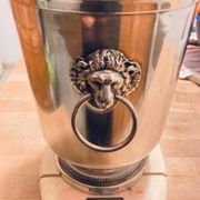 Silver-plated champagne bucket with lion heads from the 20th century, stamped.