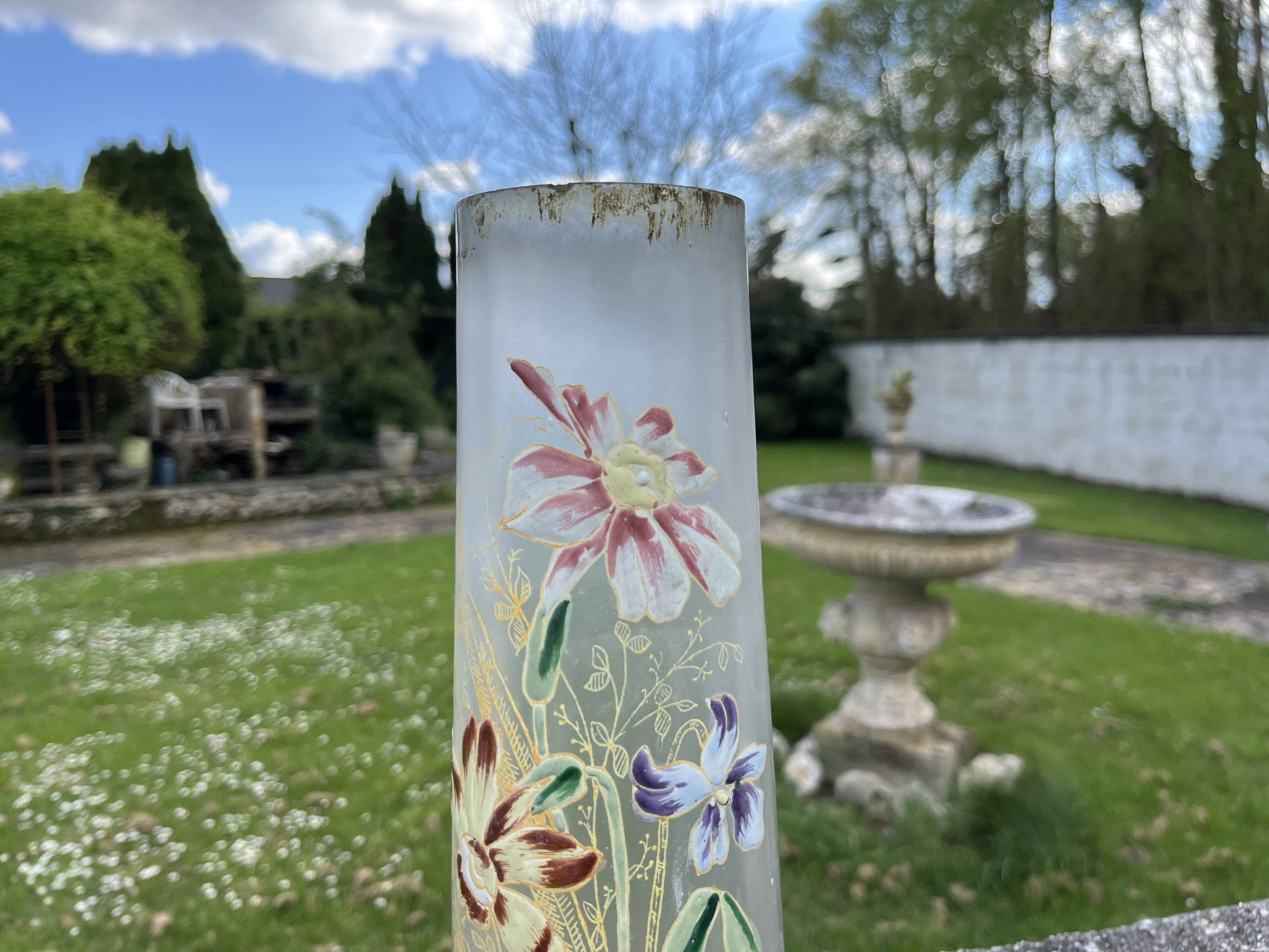 Cylindrical Art Nouveau vase with enamelled decoration of violets.
