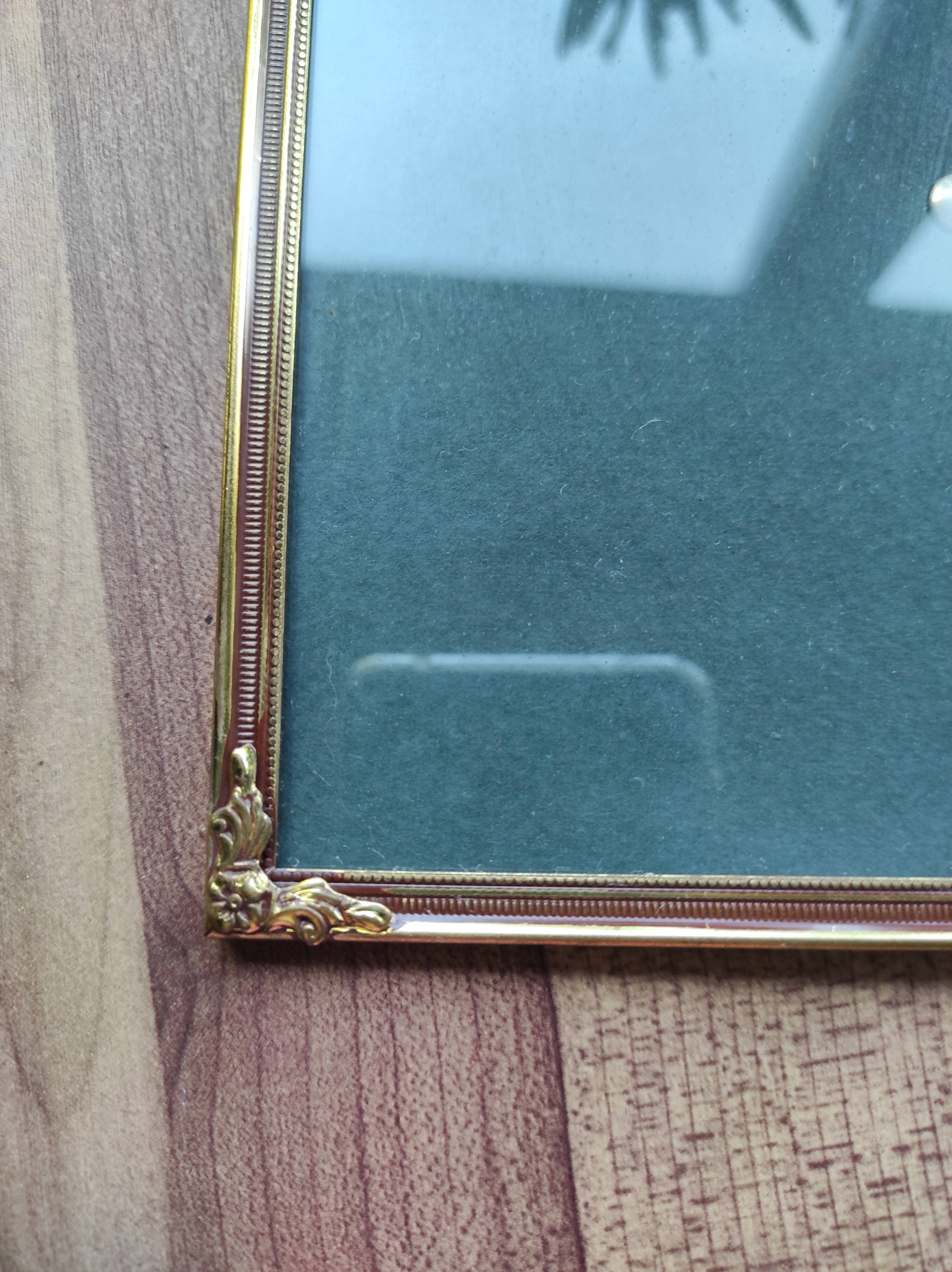 Vintage photo frame in gold and decorated metal