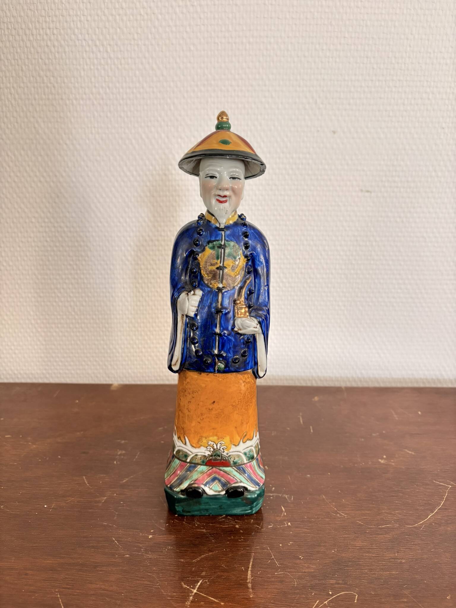 Chinese Porcelain Sculpture of a Manchu Mandarin Qing Pipe Smoker
