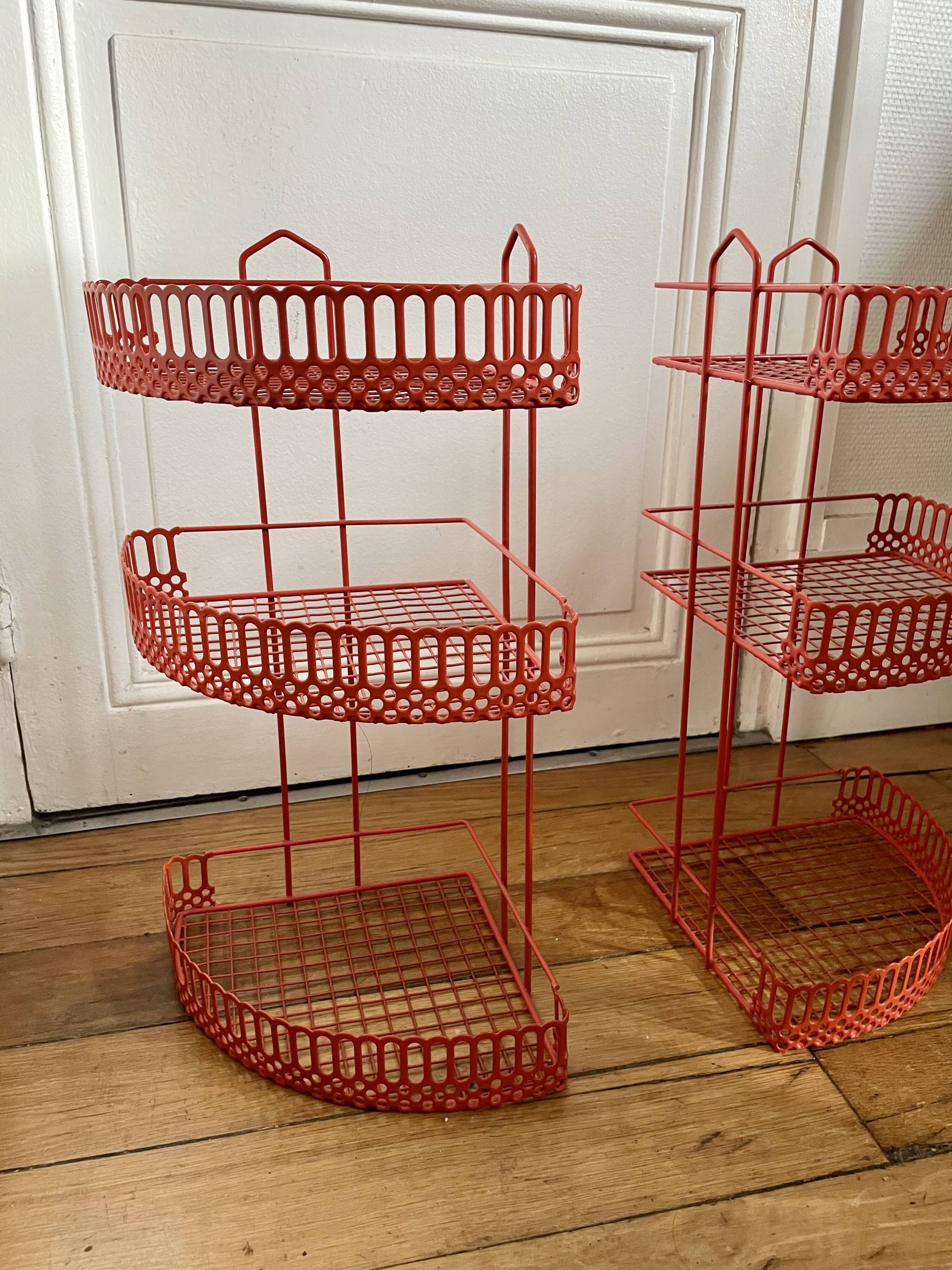 Red enamelled metal wall shelves