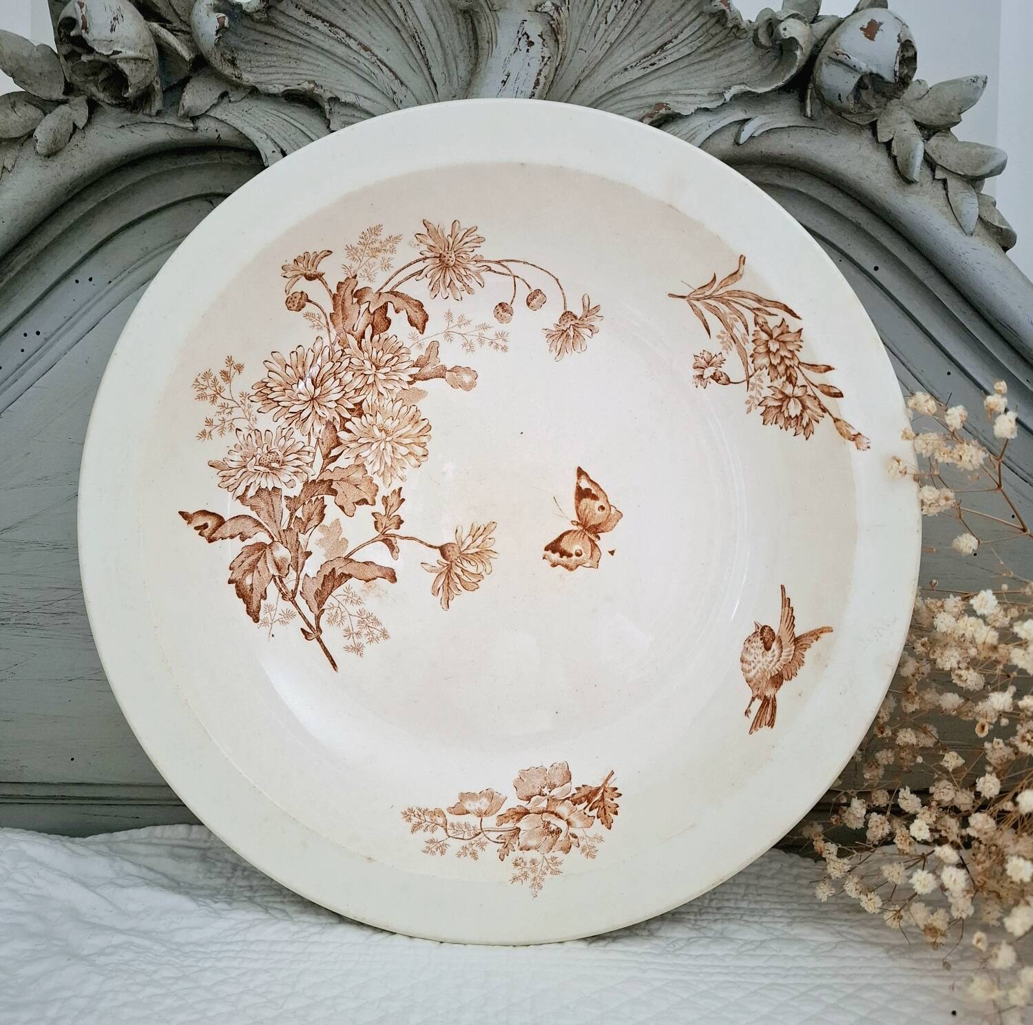 Antique iron earthenware plates accompanied by dishes