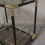 Black metal and brass rolling dessert trolley, smoked glass, 1970s.