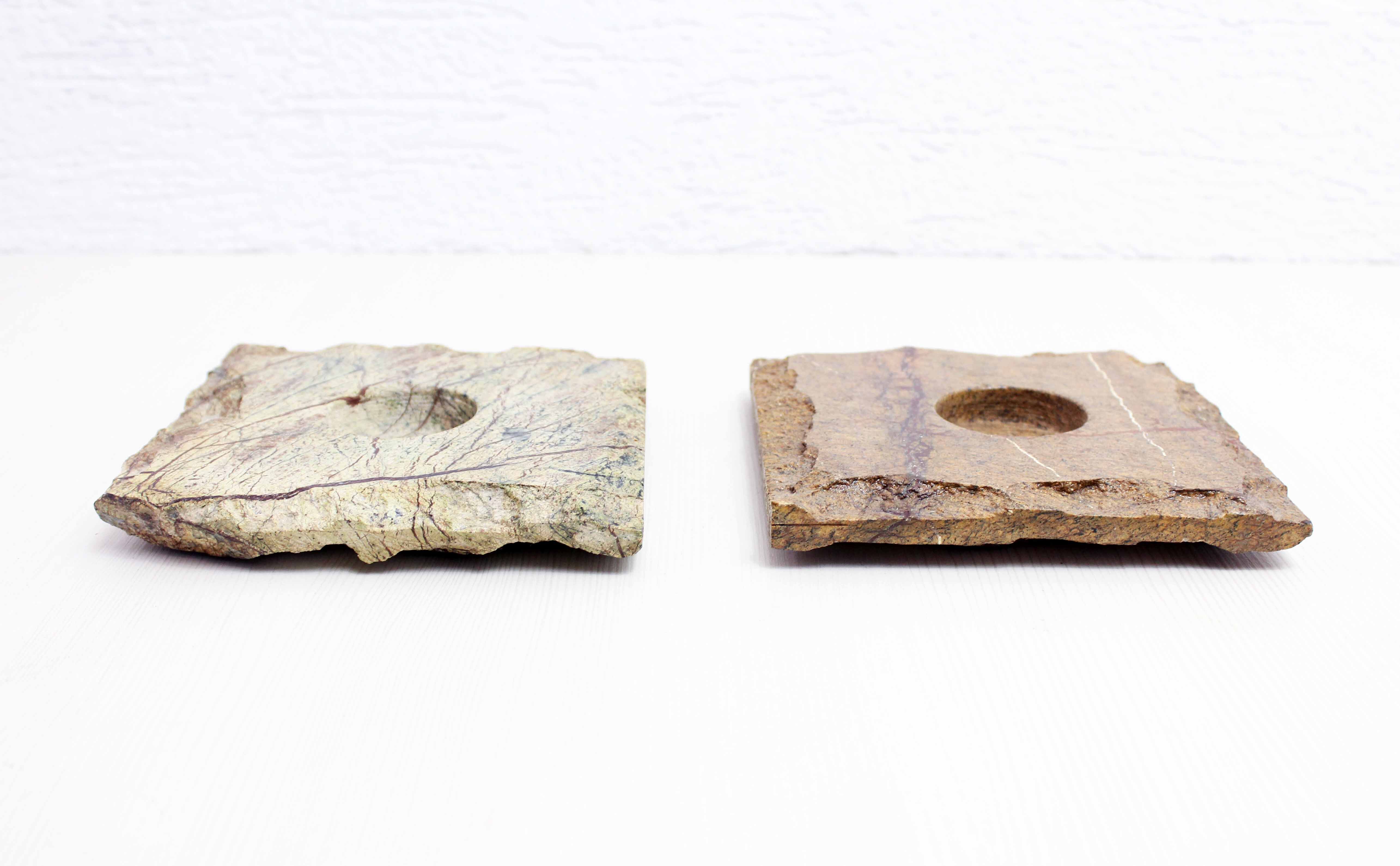 Pair of brutalist travertine candle holders