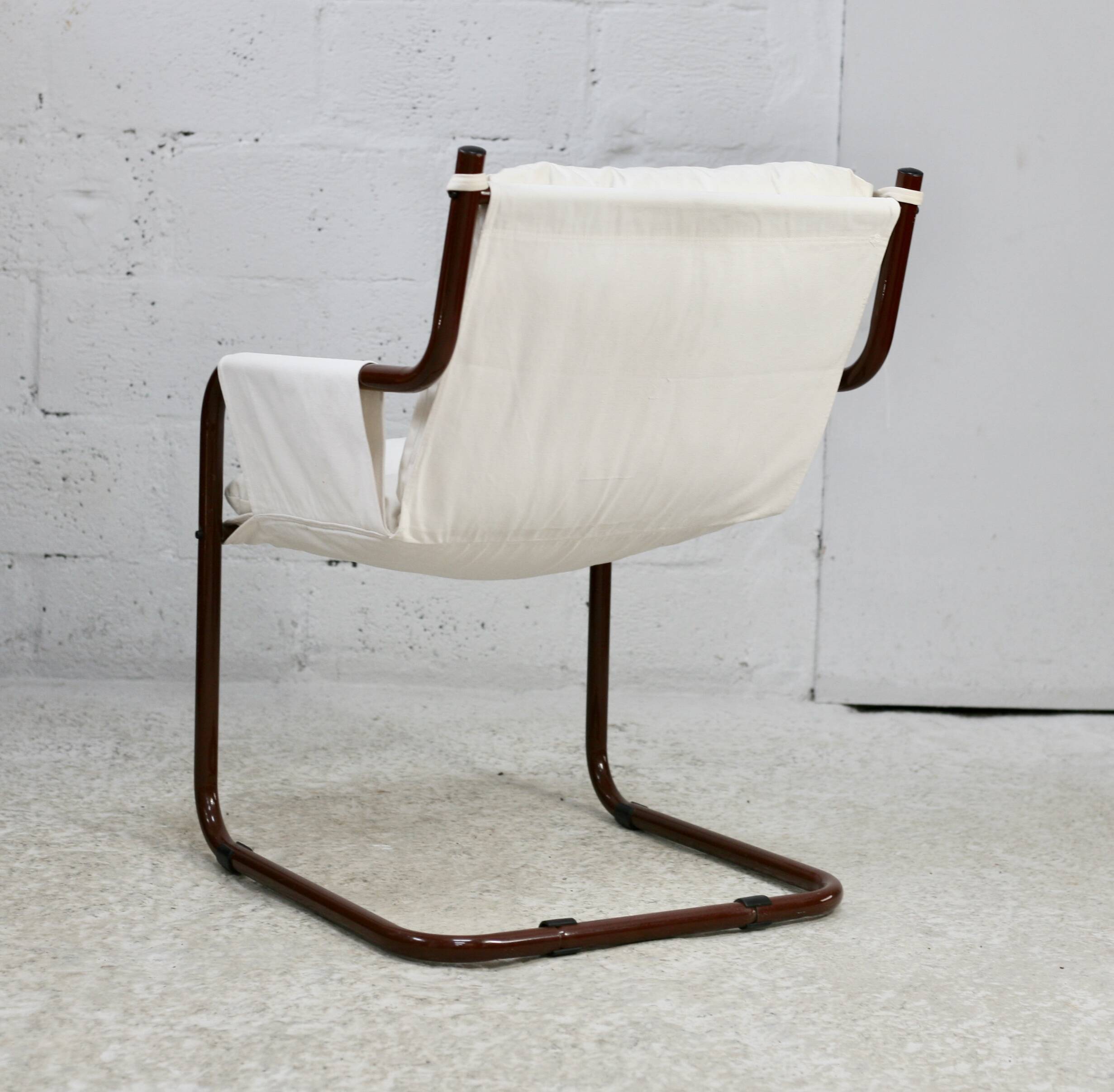 Tubular armchair, fabric suspended seat. Circa 1970