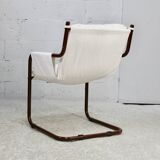 Tubular armchair, fabric suspended seat. Circa 1970