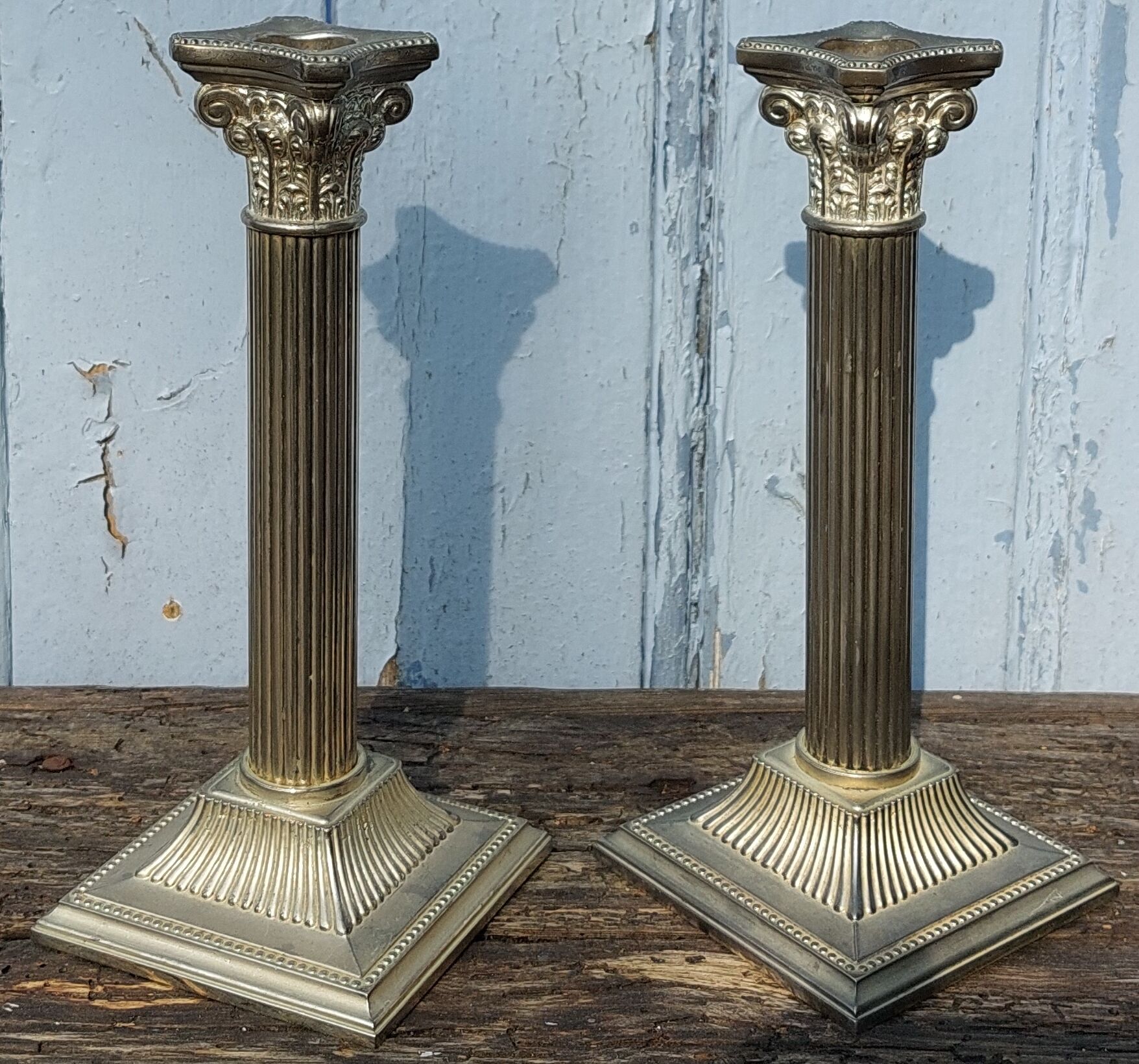 Duo of silver metal column candle holders