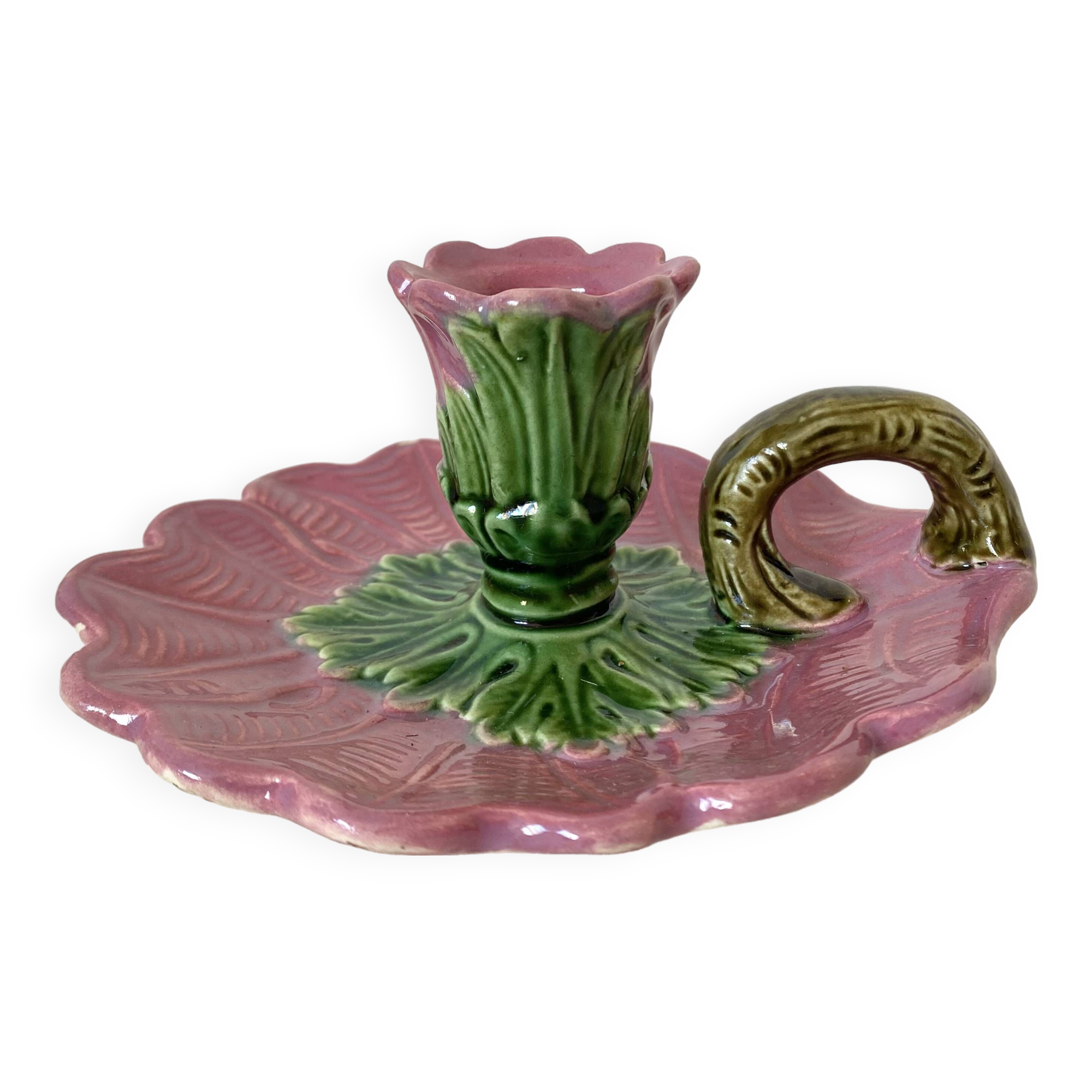 Antique slip candlestick depicting a flower
