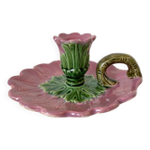 Antique slip candlestick depicting a flower