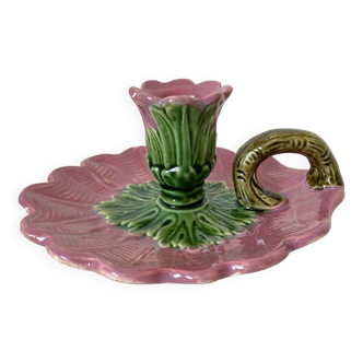 Antique slip candlestick depicting a flower