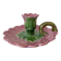 Antique slip candlestick depicting a flower