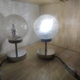 Duo of lamps in textured globe with a great play of light.
