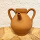 Small terracotta jar