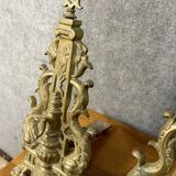 pair of Empire period dolphin firedogs in gilded bronze