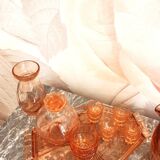 Pink glass liquor service and its accessories from the 1950s