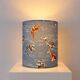 Handmade lampshade covered with Japanese fabric featuring car patterns.