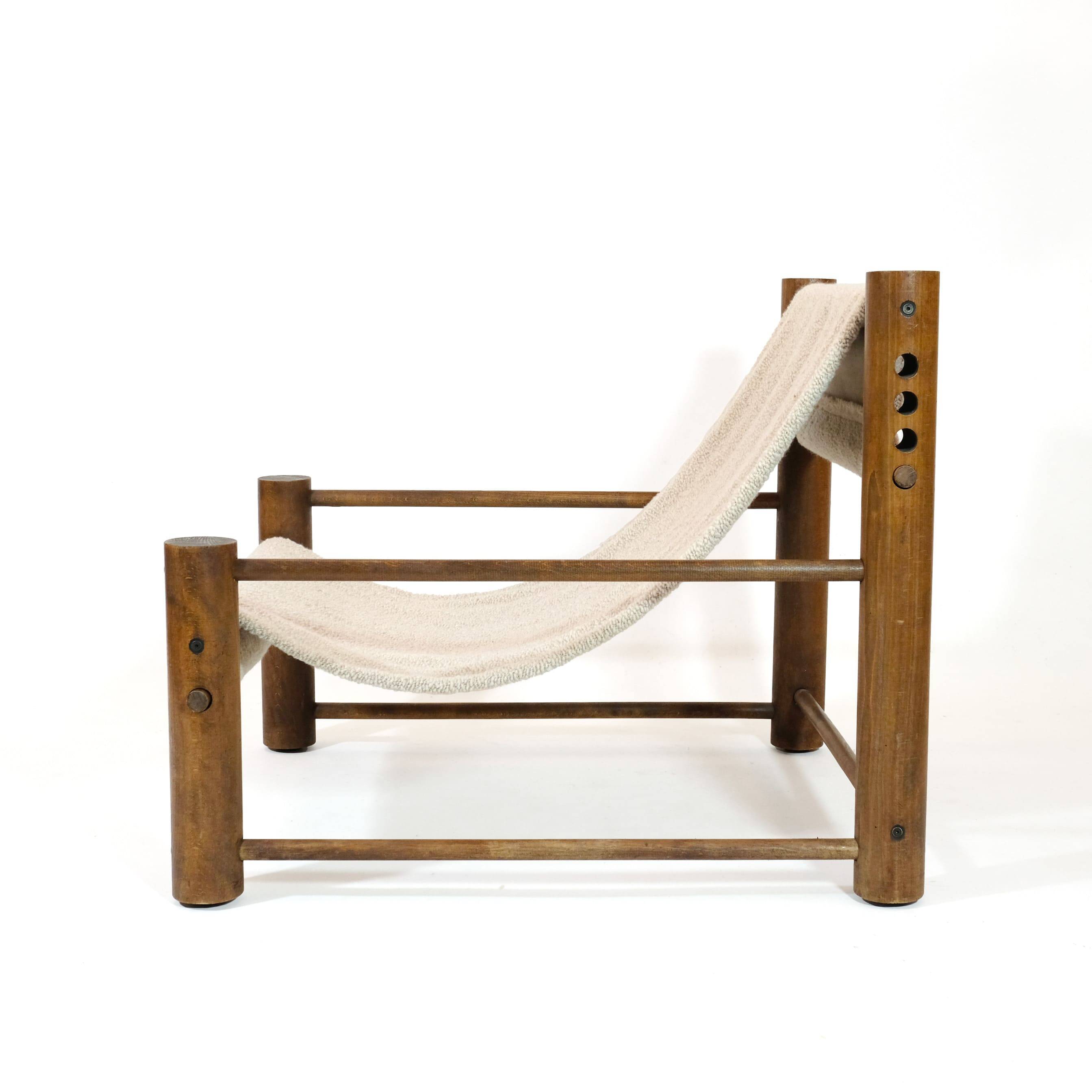 Solid wood armchair with adjustable backrest.