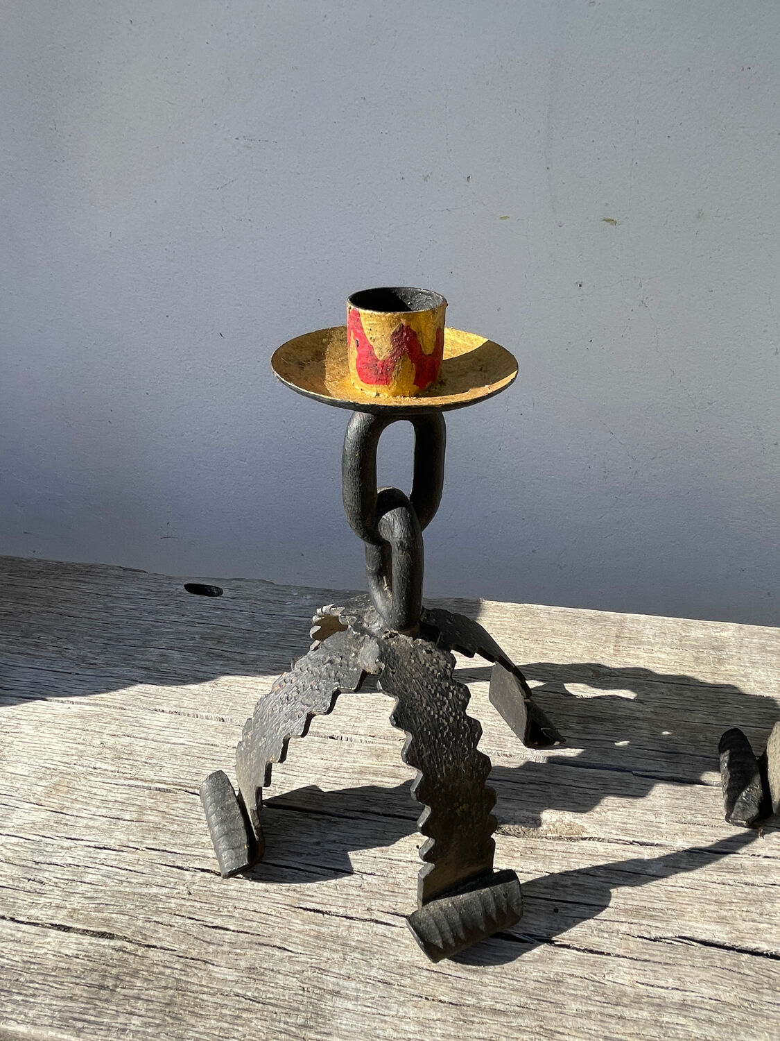 Pair of candlesticks with wrought iron chain