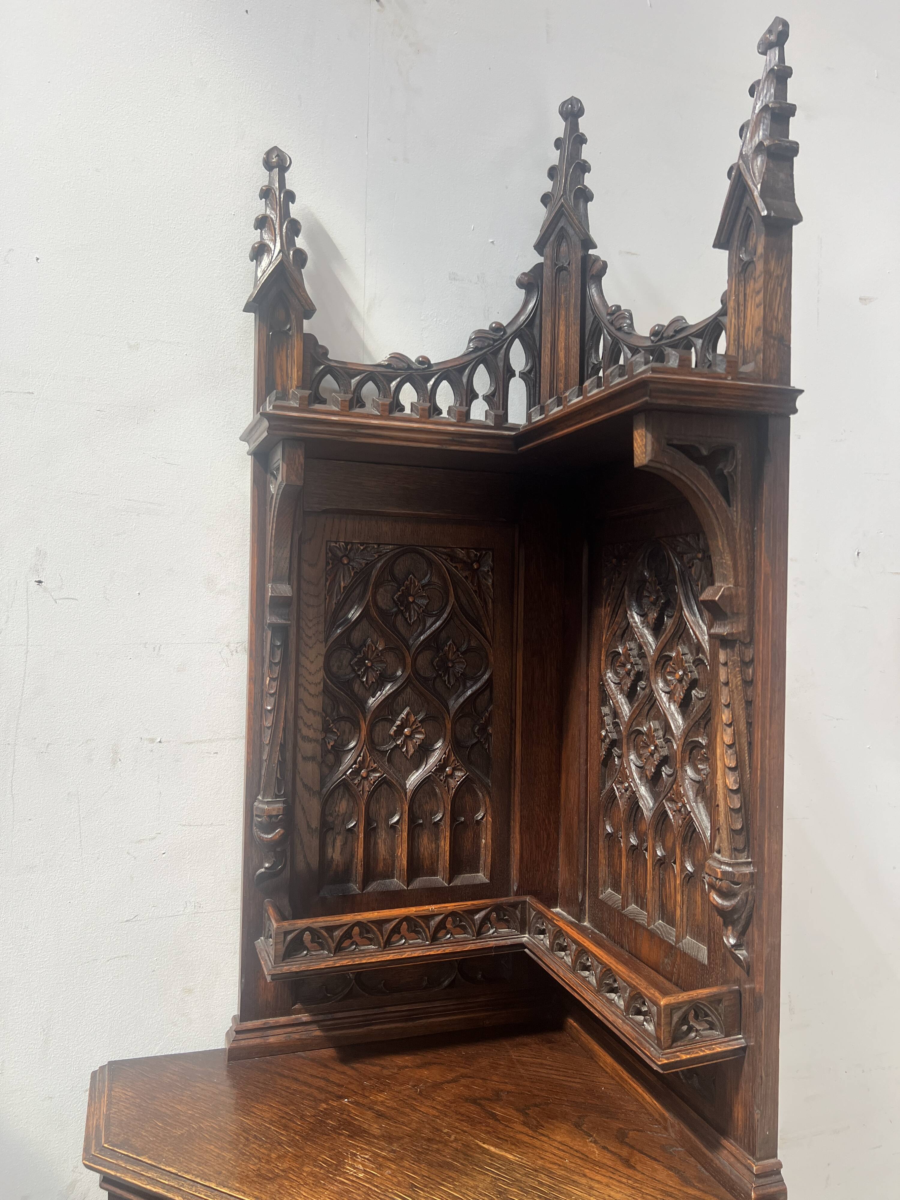 Gothic-style corner cabinet in solid oak, 20th century.