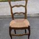 Solid oak carved chair with rush seating, Louis XV style, 19th century.
