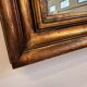 Miroir ancien en bois doré à la feuille